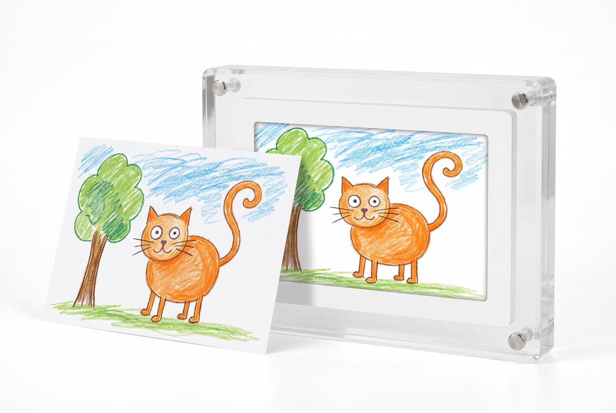Child's cat drawing next to the Little Picasso Frame showing the same drawing