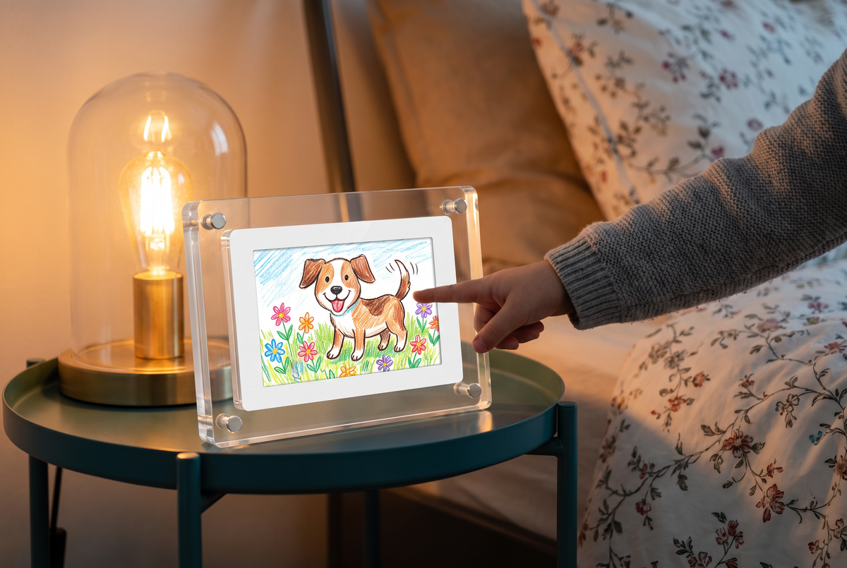 Child pointing at an animated dog drawing on the Little Picasso Frame on a nightstand